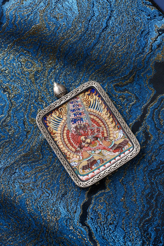 Maha Heruka thangka pendant depicting the Vajrayana wrathful deity, symbolizing profound transformation and enlightened power.