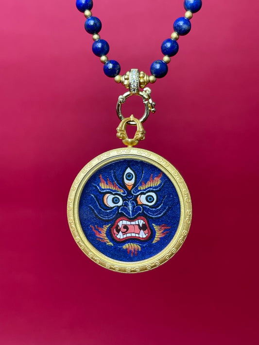 Close-up detail of the Tibet Mahakala Thangka showing coarse lapis lazuli texture and three-dimensional artistry.