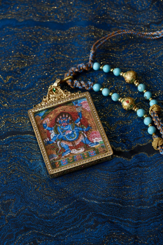 Mahakala six-armed thangka pendant representing the Tibetan Buddhist protector, providing courage, wisdom, and the removal of obstacles.