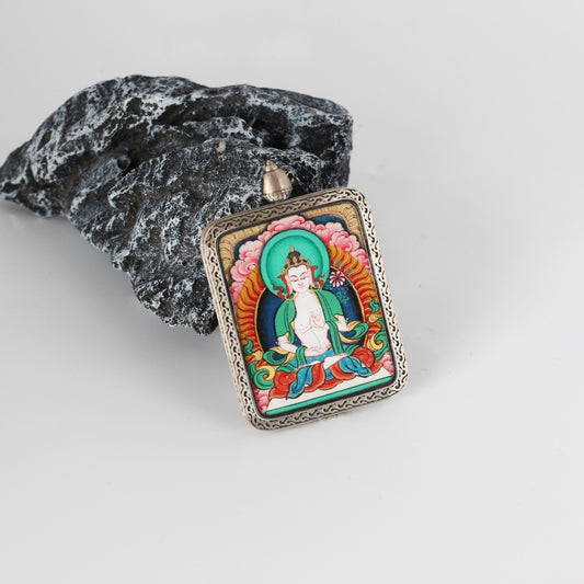 A 2.5x3.5cm hand-painted Karma Kagyu Mahasthamaprapta Bodhisattva Thangka pendant featuring the Bodhisattva of Great Strength, encased in titanium steel, representing wisdom and strength in Tibetan Buddhist tradition.