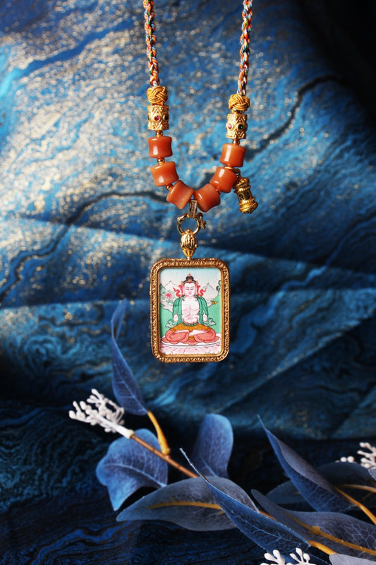 The Karma Kagyu Mahasthamaprapta Thangka pendant displayed as a sacred amulet for wisdom and power, embodying the great strength of Tibetan Buddhist tradition.