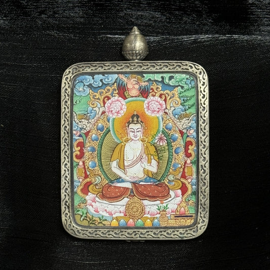 Close-up detail of the Menri Mahasthamaprapta Thangka painting showing intricate natural mineral pigment work and symbolic attributes, showcasing the artistry of Tibetan lineage painters.