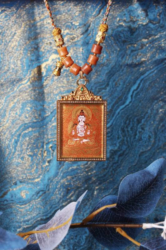 The Rebgong Mahasthamaprapta Thangka pendant displayed as a sacred amulet for wisdom and power, embodying the great strength of Tibetan Buddhist tradition.