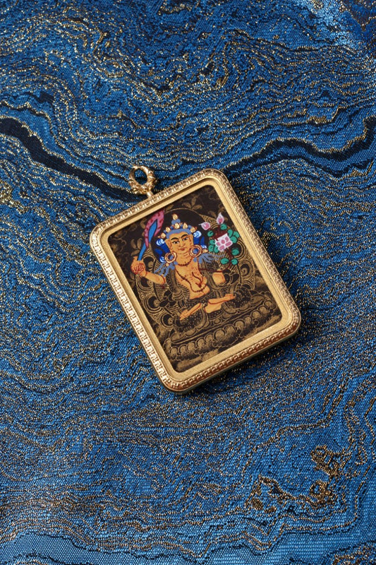 Manjushri Bodhisattva thangka pendant depicting the Tibetan Buddhist deity of wisdom and insight, symbolizing enlightenment and knowledge.