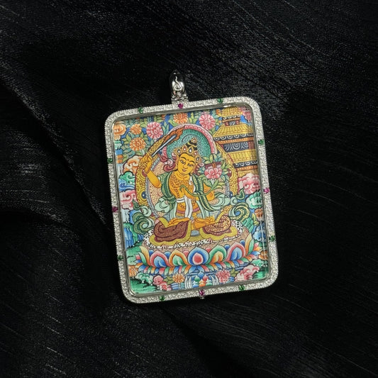 A 4x5cm hand-painted Manjushri Bodhisattva with Eight Guardians and Mandala Thangka pendant featuring the Bodhisattva of Wisdom, representing wisdom and success in Tibetan Buddhist tradition.