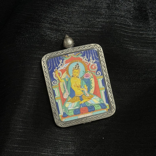 Close-up detail of the Karma Kagyu Manjushri Thangka painting showing intricate natural mineral pigment work and sword-of-wisdom symbolism, showcasing the masterful artistry of Tibetan lineage painters.