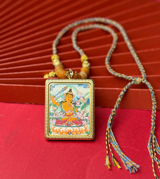 Close-up detail of the Nepal Manjushri Thangka showing hand-painted mineral pigments, showcasing the masterful artistry.