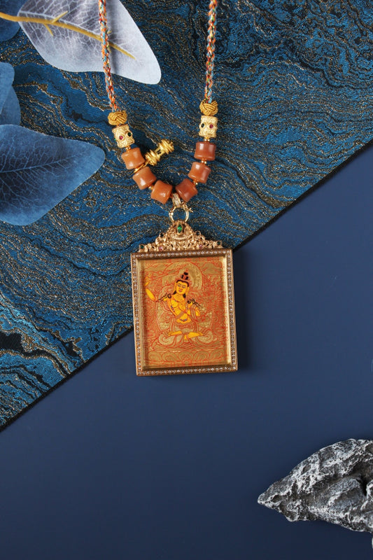 A 4x5cm hand-painted Rebgong Manjushri Bodhisattva Thangka pendant featuring the Bodhisattva of Wisdom, encased in titanium steel, representing wisdom and clarity in Tibetan Buddhist tradition.