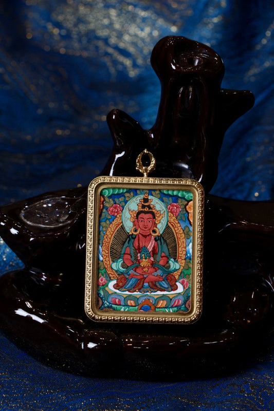 Amitayus thangka amulet symbolizing long life, vitality, and spiritual blessings in Tibetan Buddhism.