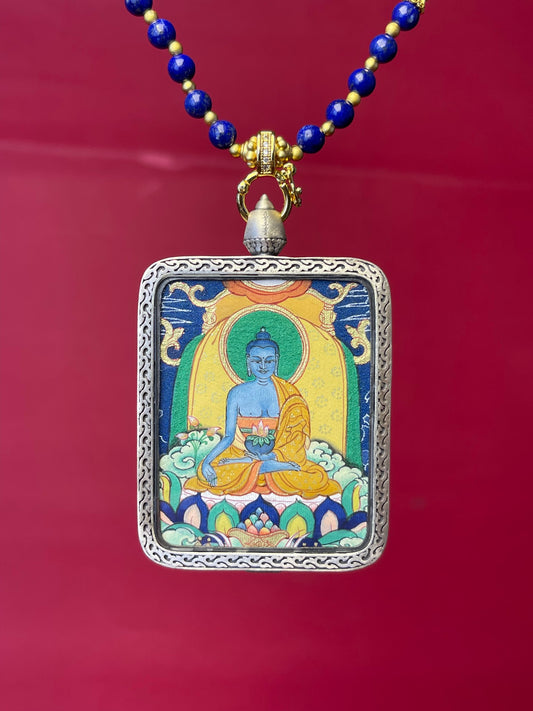 Detailed view of the copper casing for the Medicine Buddha Thangka pendant, symbolising healing and tradition in Buddhist practice.