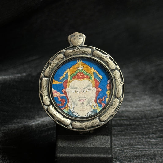 Close-up detail of the Tibet Padmasambhava Thangka painting showing natural mineral pigments, showcasing the masterful artistry of Tibetan lineage painters.