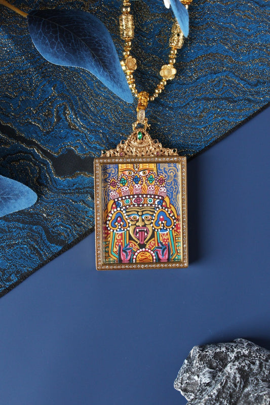 The Tibetan Buddhist Palden Lhamo Thangka pendant displayed as a sacred protective amulet for wealth, protection, and spiritual practice, embodying the fierce wisdom and compassionate protection of Tibetan Buddhist tradition.
