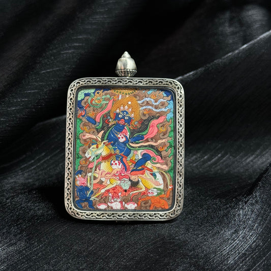 Detailed view of the casing and presentation for the Palden Lhamo Thangka pendant.