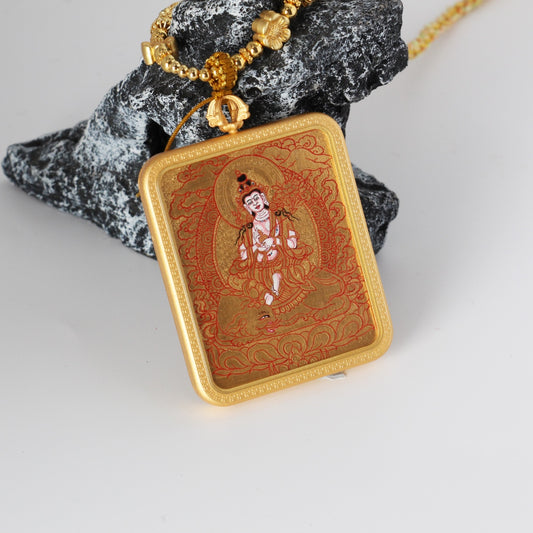 The Karma Kagyu Samantabhadra Thangka pendant displayed as a sacred amulet for virtue and practice, embodying Tibetan Buddhist tradition.