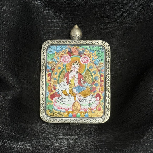 Close-up detail of the Menri Samantabhadra Thangka painting showing intricate natural mineral pigment work and symbolic attributes, showcasing the artistry of Tibetan lineage painters.