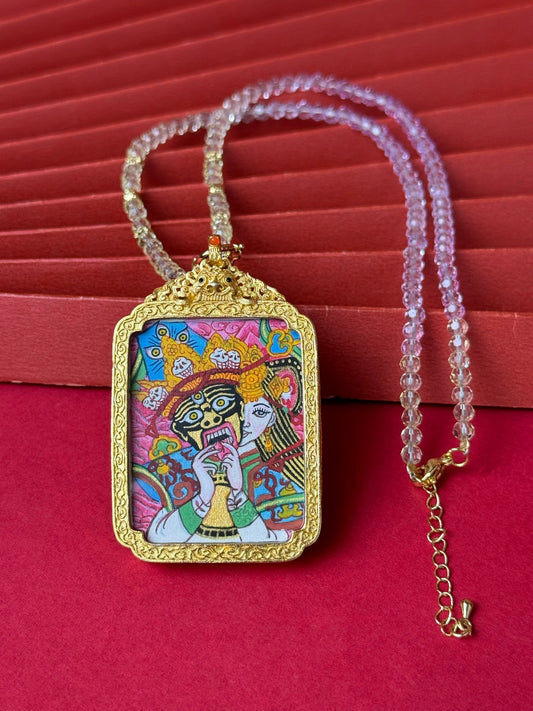 Detailed view of the refined copper casing for the Shachilama Past and Present Thangka pendant, symbolising perseverance and tradition in Buddhist practice.