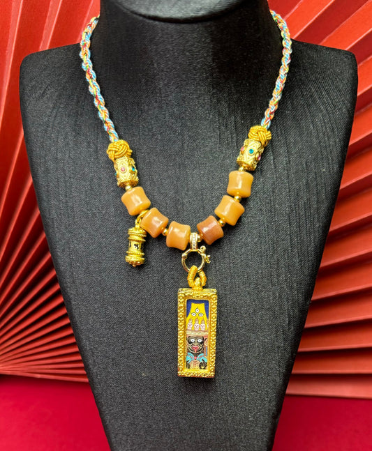 Close-up detail of the Rekong Shachilama Thangka showing hand-painted mineral pigments and lapis, showcasing the masterful artistry and rich texture.