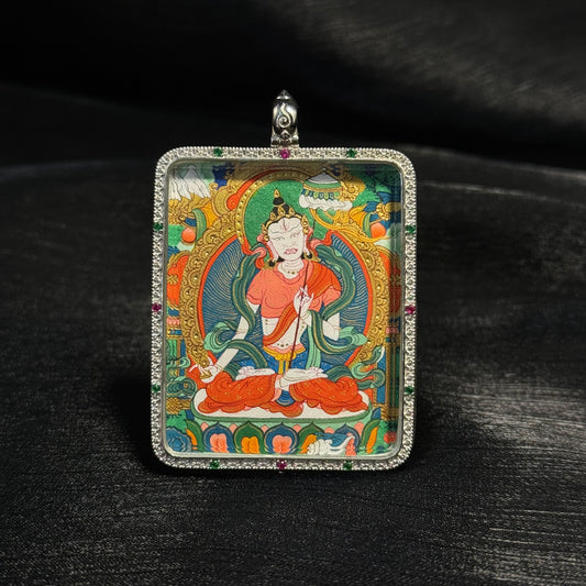 Detailed view of the casing and presentation for the Sita Patrika Ushnisha Thangka pendant, symbolising tradition and collectibility.