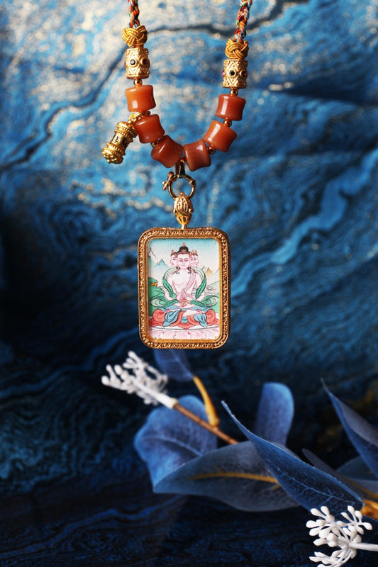 The Karma Kagyu Vairocana Buddha Thangka pendant displayed as a sacred amulet for wisdom and success, embodying the cosmic light of Tibetan Buddhist tradition.