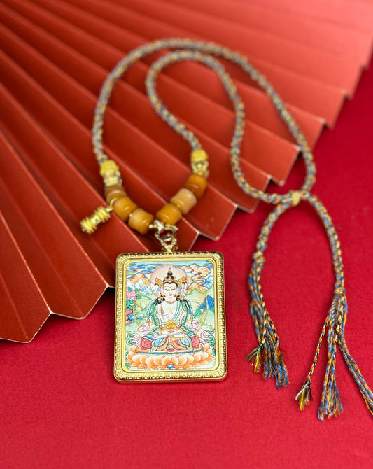 Hand-painted Nepal Vairocana (大日如来) Thangka pendant 4x5cm with titanium casing featuring the Buddha of Cosmic Illumination, representing wisdom and the accomplishment of endeavours in Buddhist tradition.