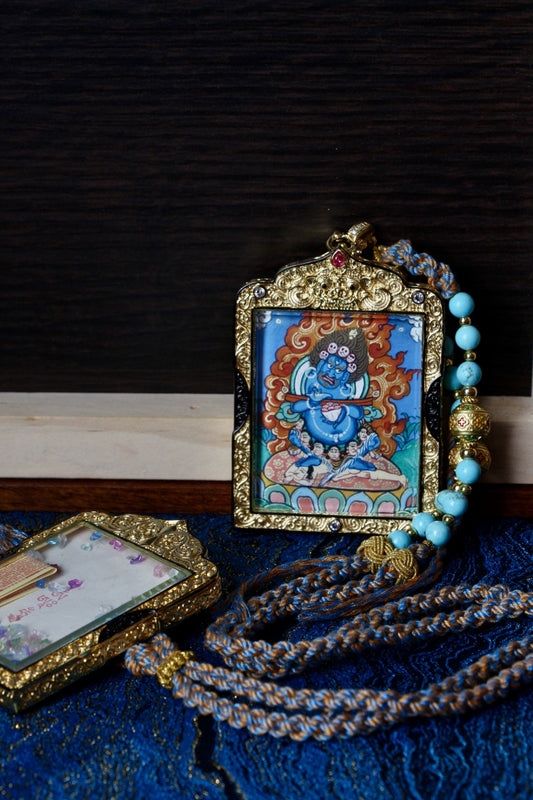 Vaishravana wealth deity thangka amulet used in Tibetan Buddhism to attract prosperity and safeguard spiritual practice.