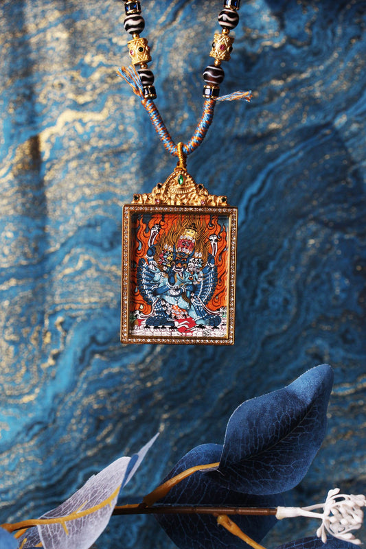 The Nepal Vajrabhairava Thangka pendant displayed as a sacred amulet for protection and fierce wisdom, embodying the conqueror of death in Tibetan Buddhist tradition.