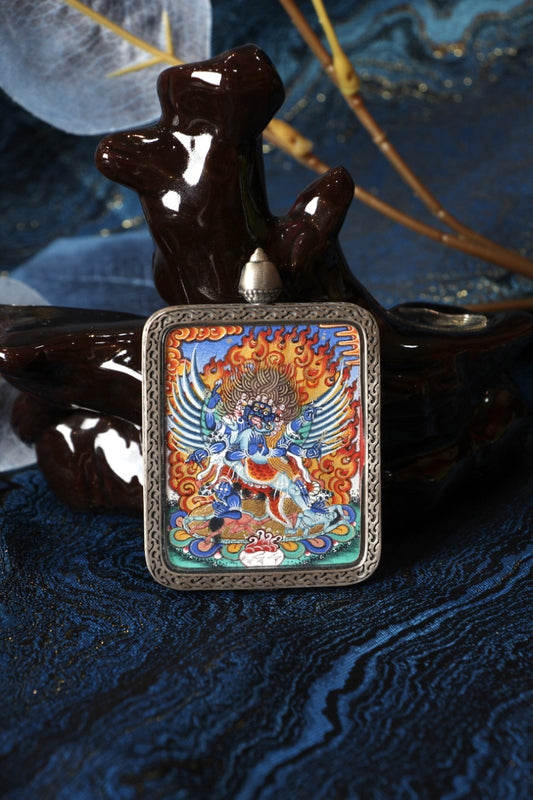 Sacred Tibetan thangka pendant of Phurba, associated with Himalayan spiritual power, wrathful protection, and purification.