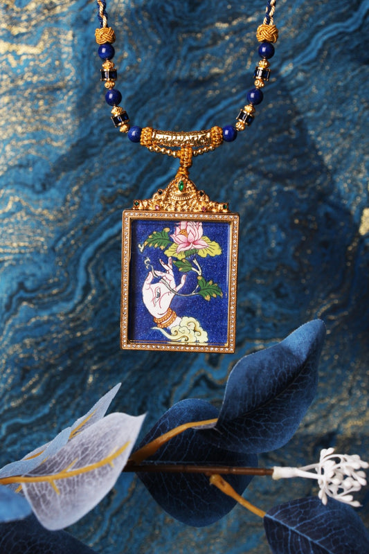 The White Tara Buddha Hand Thangka pendant displayed as a sacred amulet for longevity and compassion, embodying the healing wisdom of Tibetan Buddhist tradition.