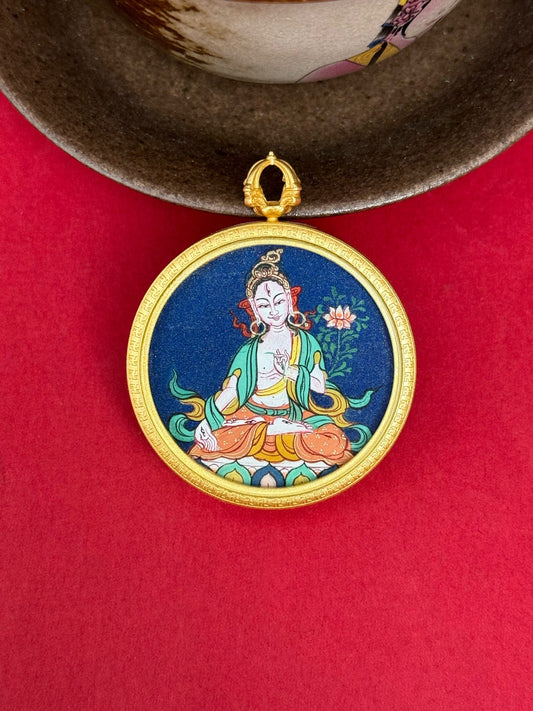 Close-up detail of the Tibet Bold White Tara Thangka showing hand-painted mineral pigments, showcasing the masterful artistry.