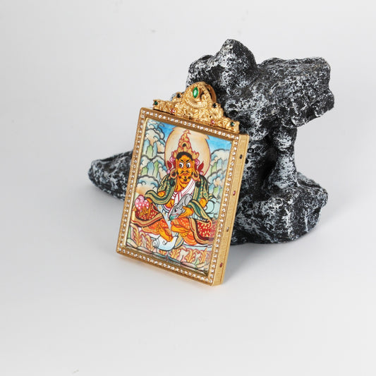 Close-up detail of the Nepal Gardri Yellow Jambhala Thangka painting showing intricate natural mineral pigment work, showcasing the masterful artistry of Nepali lineage painters.