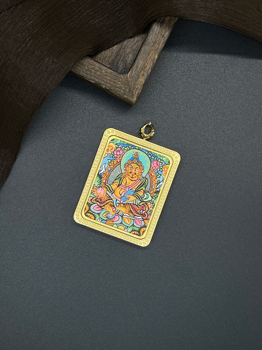 Hand-painted Nepal Yellow Jambhala (黄财神) Thangka pendant 3.5x4.5cm with titanium casing featuring the chief of wealth deities, representing the bestowal of prosperity in Buddhist tradition.