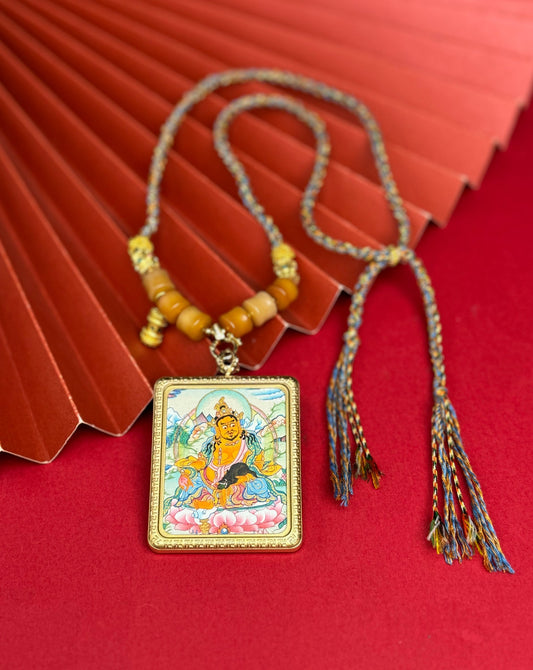 Hand-painted Nepal Yellow Jambhala (黄财神) Thangka pendant 4x5cm with titanium casing featuring the king of wealth deities, representing prosperity in Buddhist tradition.