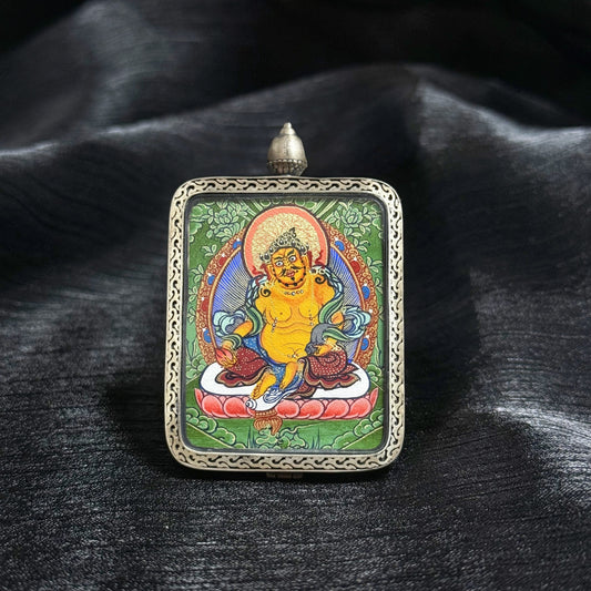 A 3.5x4.5cm hand-painted Rekong Cuiying series Yellow Jambhala (黄财神) Thangka pendant featuring the wealth deity, representing wealth and prosperity in Buddhist tradition.