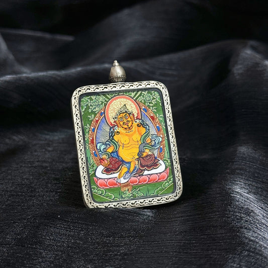 Close-up detail of the Rekong Cuiying Yellow Jambhala Thangka painting showing natural mineral pigments.