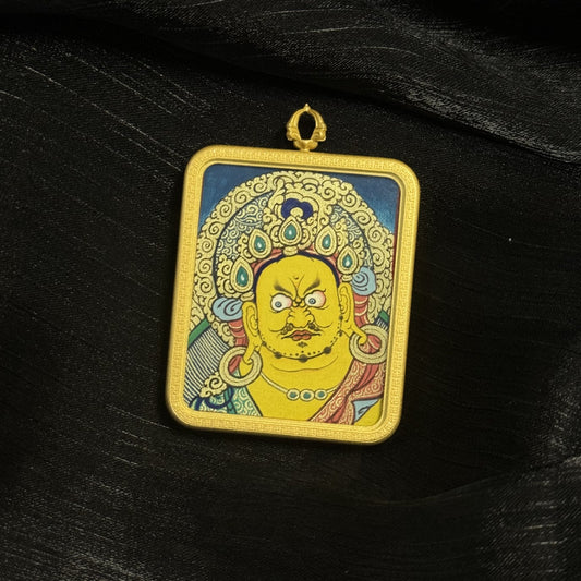 A 4x5cm hand-painted Rekong Yellow Jambhala Thangka pendant featuring the wealth deity, representing abundance, merit and blessing in Tibetan Buddhist tradition.