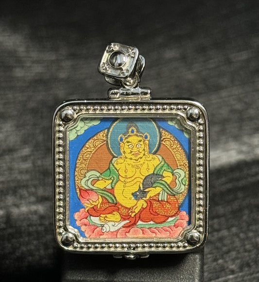 A 2x2cm hand-painted Rekong Yellow Jambhala Thangka pendant featuring the King of Wealth, representing wealth and fortune in Buddhist tradition.