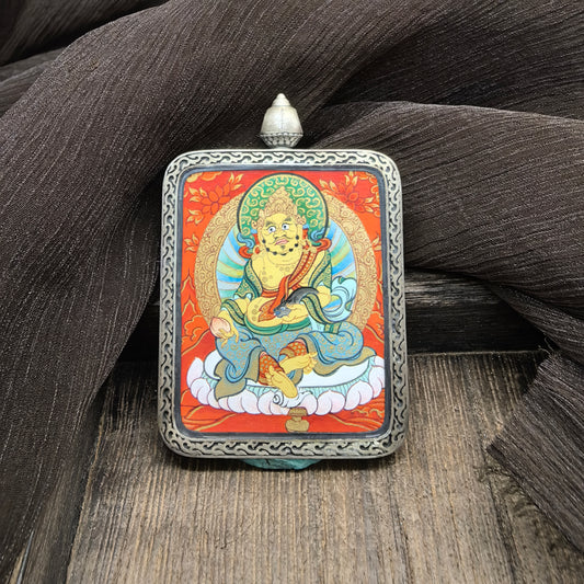 Detailed view of the deer relief silver casing for the Yellow Jambhala Thangka pendant, symbolising wealth and tradition in Buddhist practice.
