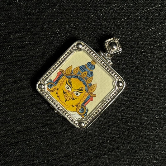 Close-up detail of the Tibet Yellow Jambhala Thangka painting showing natural mineral pigments, showcasing the masterful artistry of Tibetan lineage painters.