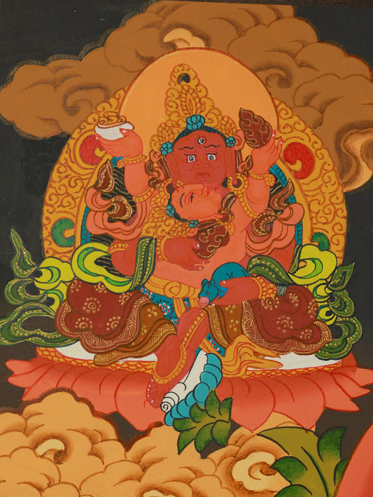 Traditional Tibetan thangka art of Yellow Jambhala, the Buddhist god of wealth and spiritual generosity