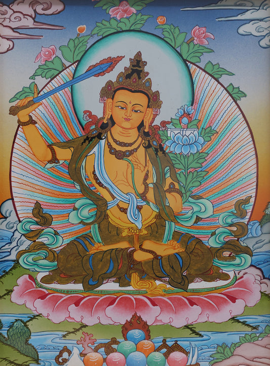 A Tibetan Buddhist Manjushri Bodhisattva thangka depicting the wisdom deity holding the flaming sword of insight