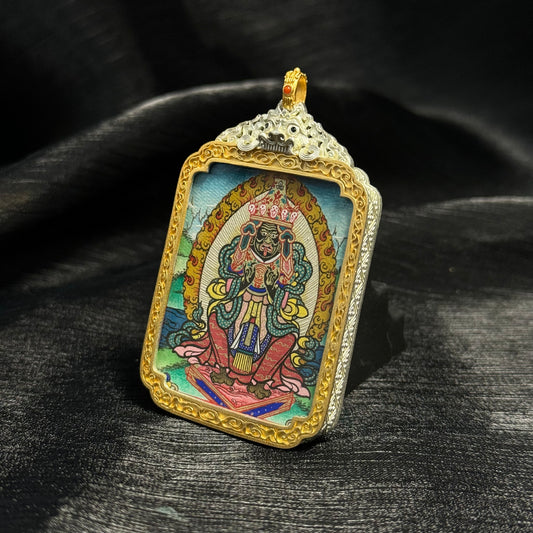 Close-up detail of the Rekong Zaki Lhamo premium Thangka painting showing natural mineral pigments and gold.