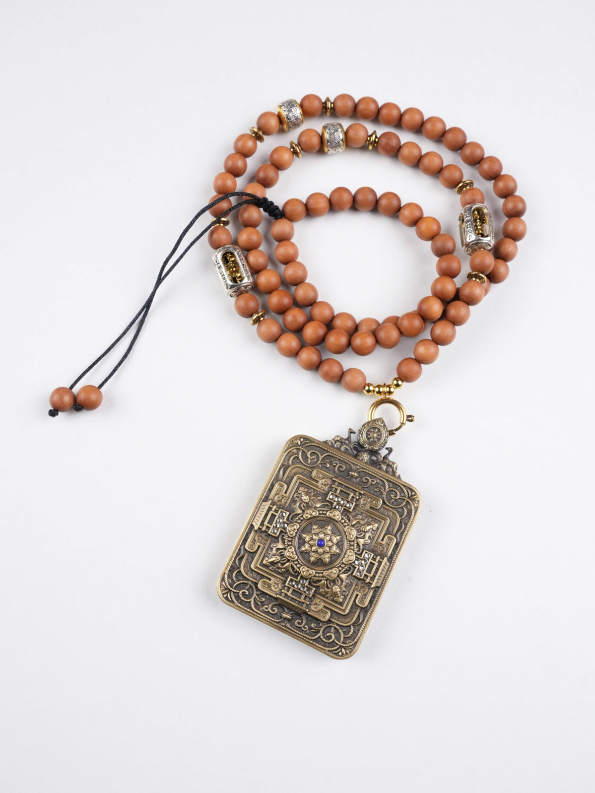Mini Tibetan thangka pendant of Dzambhala, zodiac guardian and wealth deity, offering prosperity and blessings for all twelve zodiac signs.