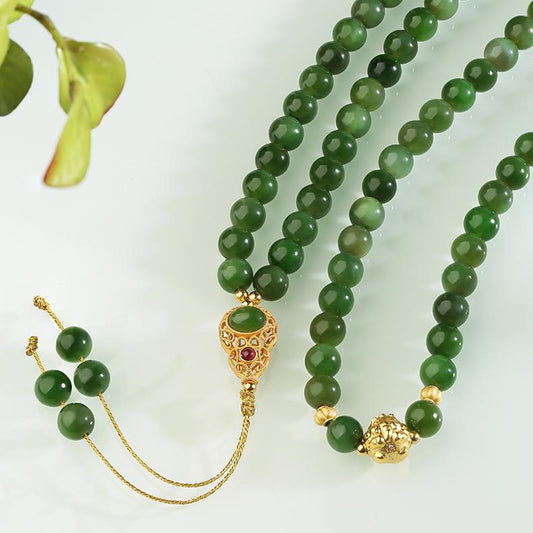 Green jade 108 mala beads with Tibetan silver elephant deity charm, handmade for wisdom and protection.