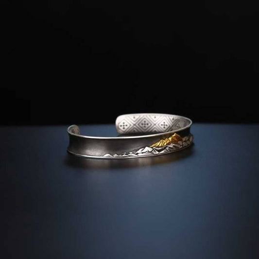 Pure gold and silver Mt. Everest bracelet featuring Tibetan Buddhist sacred design and artisan work.