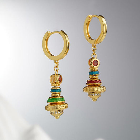Handmade Tibetan Buddhist earrings crafted from 925 silver and pearls, symbolizing purity and harmony.