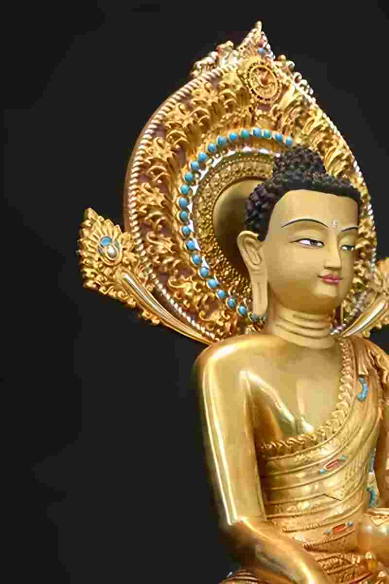 "Brass Buddha statue in Tibetan Buddhist art style, handcrafted and hand-painted for a unique aesthetic."
