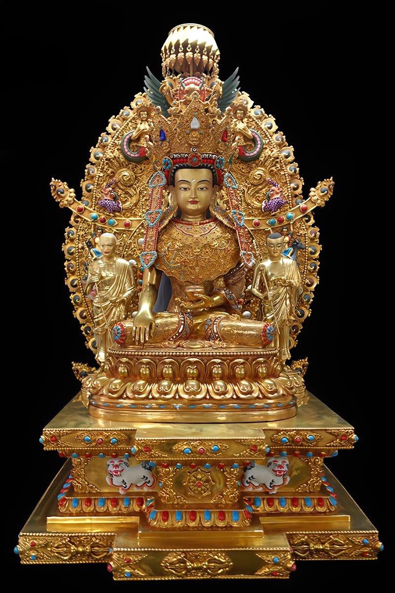 Tibetan Buddhist Jowo Buddha sculpture in golden gilded brass, representing enlightenment, prosperity, and protection in sacred spaces.