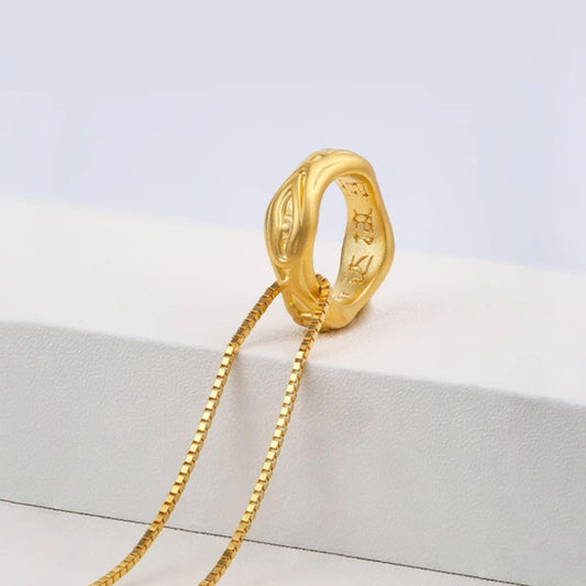 Handmade Tibetan gold and silver sacred eye pendant for enlightenment and spiritual focus.