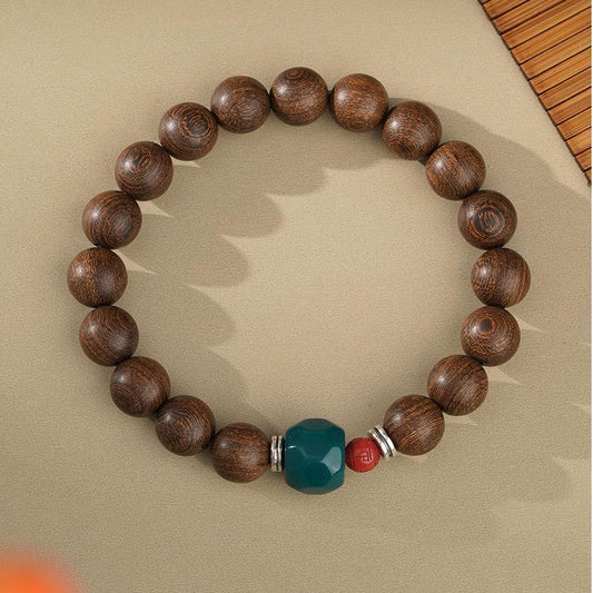 Traditional Tibetan thangka art carved on golden nanmu bracelet, featuring sacred Buddhist symbols from Potala Palace.