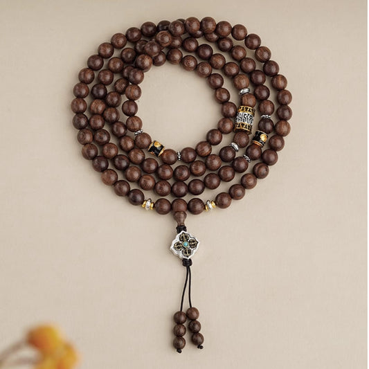 Handmade Tibetan Buddhist golden sandalwood 108 mala with copper charms inspired by thangka culture.